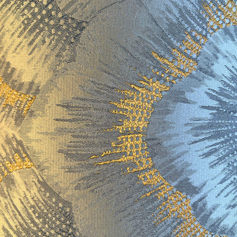 A beautiful silver and gold jacquard lampshade fabric with a delicate pattern.