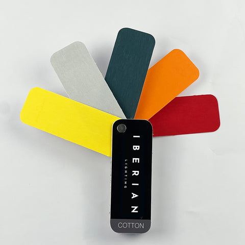 A set of fabric sample swatches in various colors spread out with the brand name 'IBERIAN' visible on one of the swatches labeled 'COTTON'.