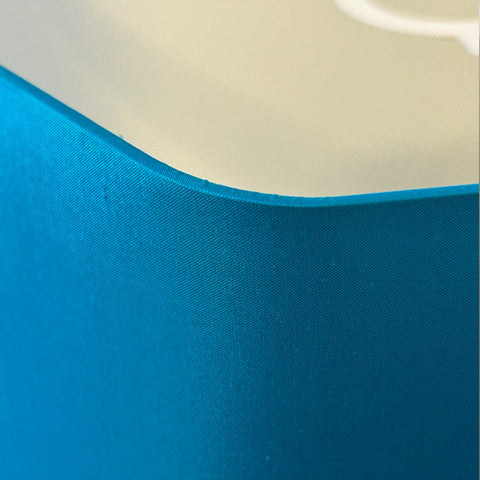 A close up view of the Hexagon Blue Silk Lampshade by Iberian Lighting