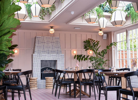A group of unusual bespoke contract lampshades, made by Iberian Lighting,  hanging in groups at the Coppa Club restaurant with a biophilic design.