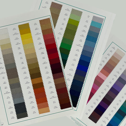 A set of fabric sample swatches in various colors spread out with the brand name 'IBERIAN' visible on one of the swatches labeled 'COTTON'.