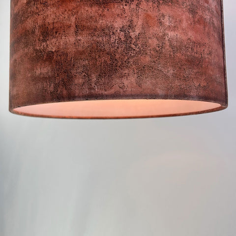 base view of a velvet drum lampshade in rich copper brown with gold highlights, showing a frosted clear inner lining; complements Pantone’s 2025 Colour of the Year, Mocha Mousse.