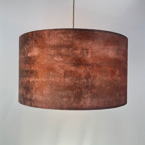 Handcrafted velvet drum lampshade in rich copper brown with gold highlights, featuring a frosted clear inner lining and beach gold frame; complements Pantone’s 2025 Colour of the Year, Mocha Mousse.