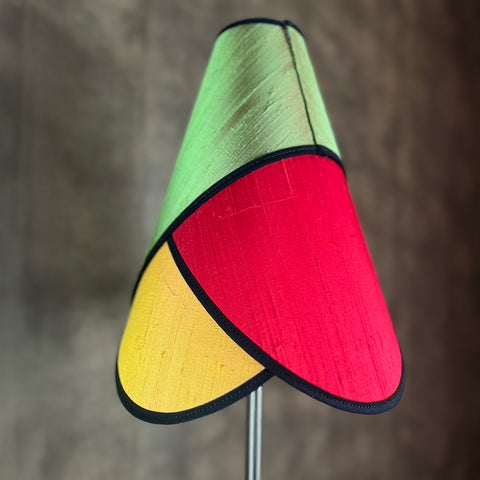 Colourful switch silk lampshade with green, red, and orange panels.