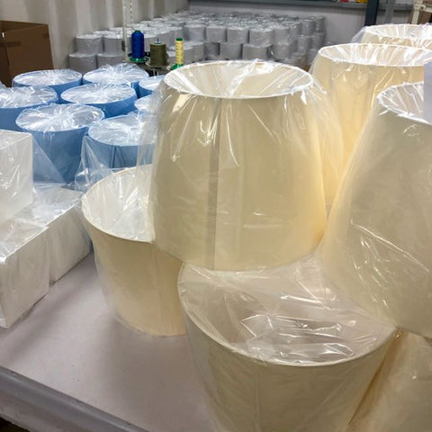 Hotel lamp shades ready for packing in a warehouse setting